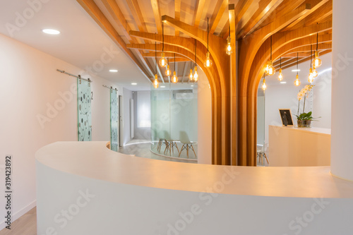 white waiting room lit with empty chairs