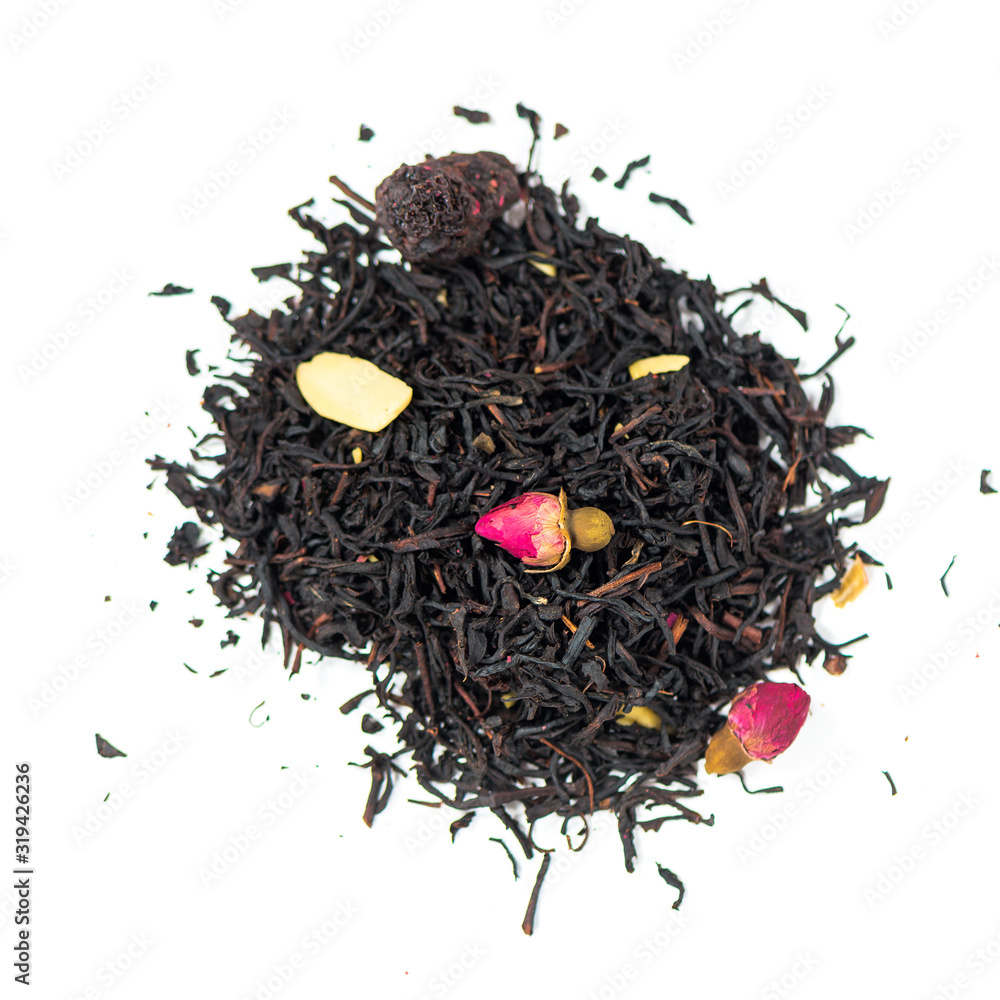 pile of natural black tea mix with candied cherries, sliced almonds and red rose buds pile of natural black tea mix with candied cherries, sliced almonds and red rose buds