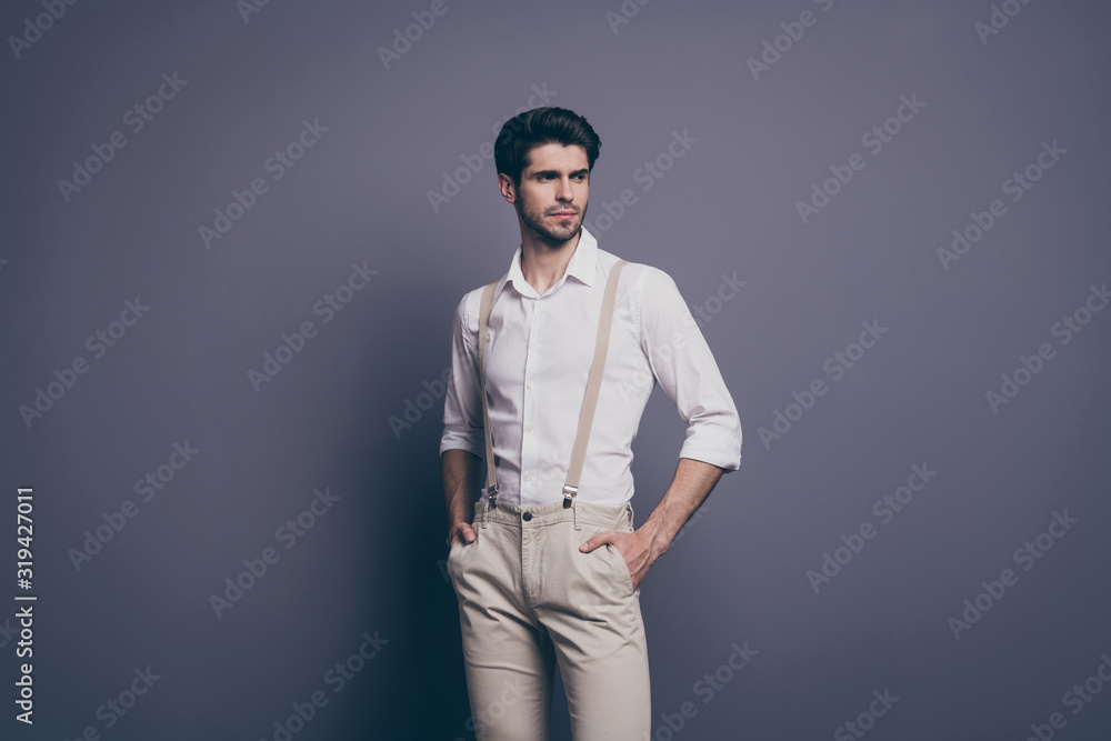 Profile side photo of elegant man feel luxury emotions want attract women copy space put hands pocket wear stylish modern clothing isolated over grey color background Profile side photo of elegant man feel luxury emotions want attract women copy space put hands pocket wear stylish modern clothing isolated over grey color background