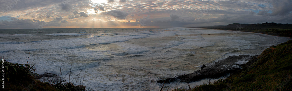 Coast Muriwai beach Auckland New Zealand. Ocean. Sunset. Panorama. Waves