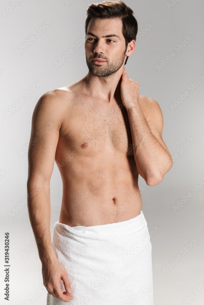 Photo of athletic half-naked man posing and looking Photo of athletic half-naked man posing and looking
