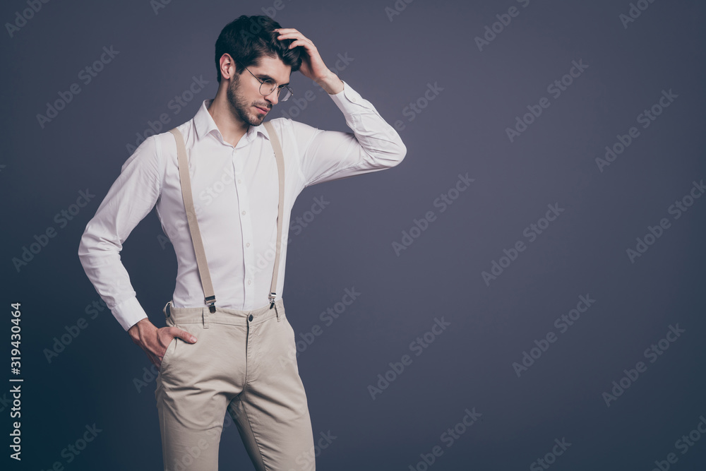 Photo of handsome business man charming responsible chief touch perfect hairdo dressed formalwear white shirt beige suspenders pants specs isolated grey color background Photo of handsome business man charming responsible chief touch perfect hairdo dressed formalwear white shirt beige suspenders pants specs isolated grey color background