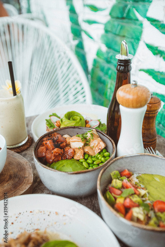 Healthy poke bowl with salmon and avocado.