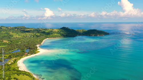 A tropical island with a turquoise lagoon and a sandbank. Caramoan Islands  Philippines. Beautiful islands  view from above. Summer and travel vacation concept.