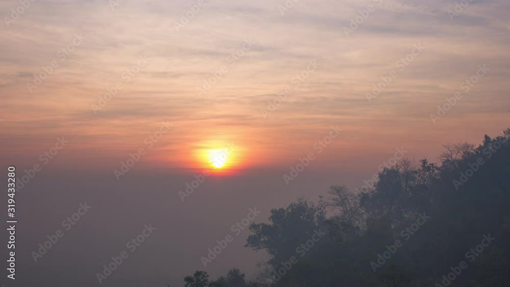 Timelapse sunrise above the mountain. Dust, fog and haze scene. 4K Video. Timelapse sunrise above the mountain. Dust, fog and haze scene. 4K Video.