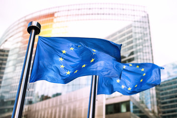 European Union flags waving in front of European Commission.