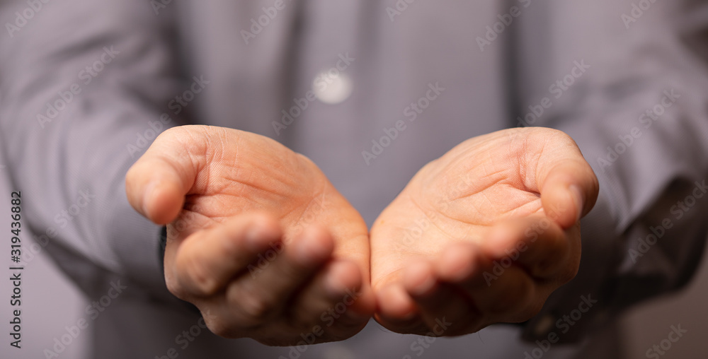 Businessman without head holding something without theme Businessman without head holding something without theme