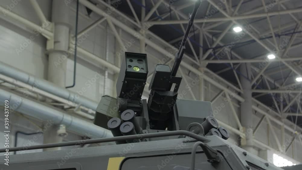 Machine gun on armored car military weapon tank truck dark green yellow camouflage camera movement Machine gun on armored car military weapon tank truck dark green yellow camouflage camera movement