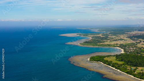 Luzon Island, Philippines. Seascape, lagoons with coral reefs, top view. Rice fields and villages on the island. Summer and travel vacation concept. © Alex Traveler