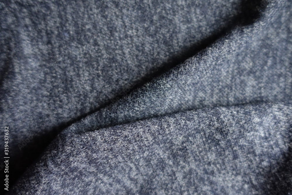 Naklejka premium Folded dark heather blue woolen fabric from above