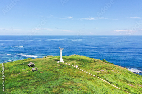 Lighthouse on a hill by the sea, top view. Basot Island, Caramoan, Camarines Sur, Philippines.