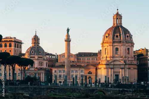 Rome, Italy - Jan 1, 2020: View across the ancient ruins of Trajan's Forum towards Trajan's Column and the Santa Maria di Loreto church in Rome, Italy