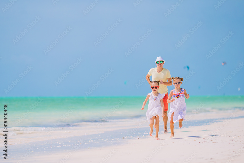 Father and little kids on the beach Father and little kids on the beach