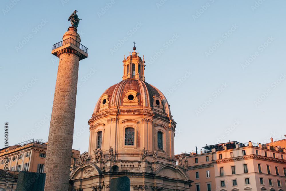 Obraz premium Rome, Italy - Jan 1, 2020: View across the ancient ruins of Trajan's Forum towards Trajan's Column and the Santa Maria di Loreto church in Rome, Italy