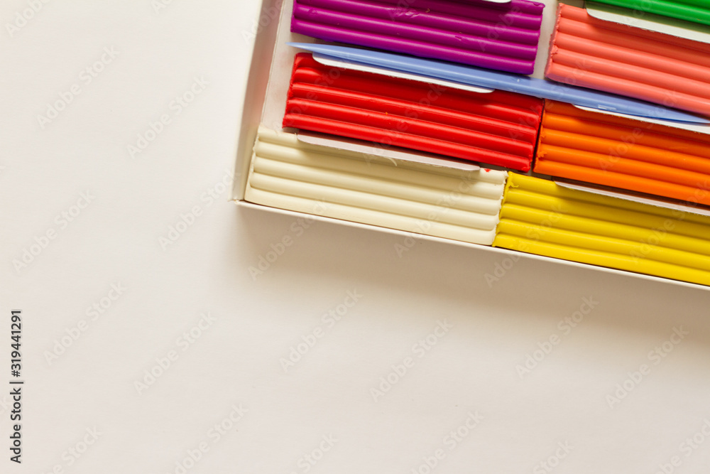 Obraz premium Set of colorful plasticine sticks isolated on white background. Modeling of clay and plasticine. creativity for children. space for text. the view from the top.