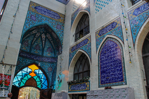 Tabriz, Iran - May 3, 2017: The Blue Mosque Masjed-e Kabud is a historic mosque and the main attraction of the city. Blue antique mosaic and unique earrings. photo