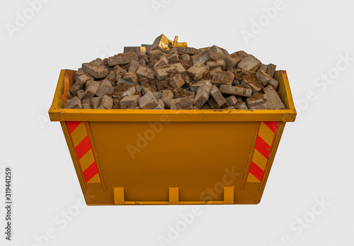 Orange domestic skip full of debris