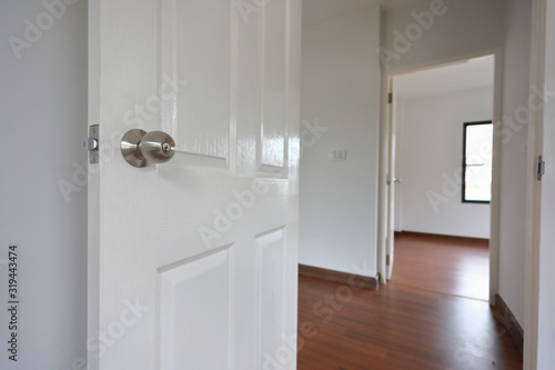 open white wooden door in new residential house