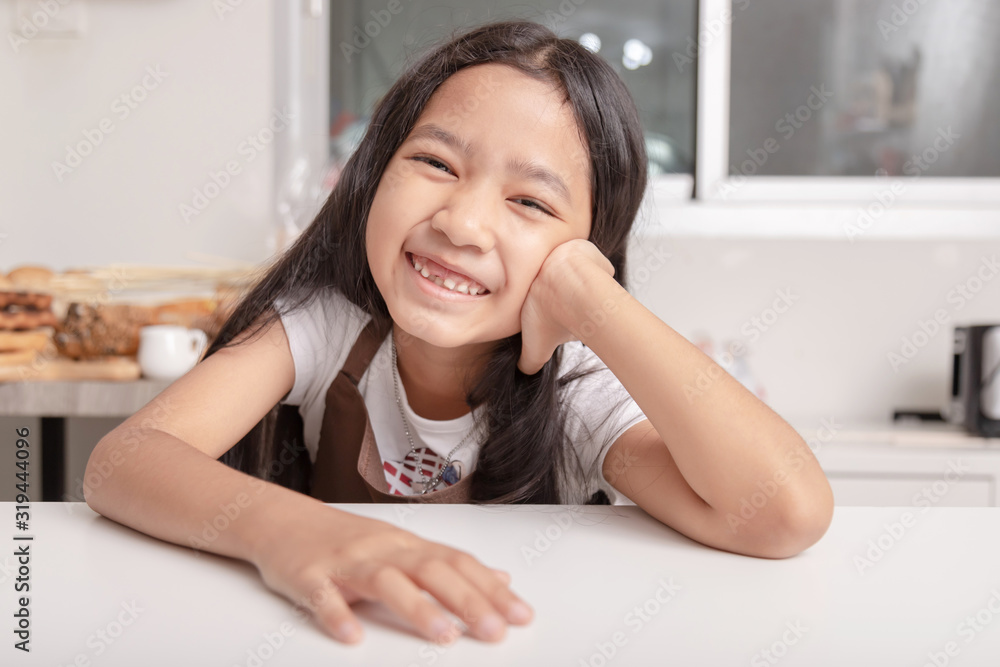 Asian little girl smiling saw her broken tooth Asian little girl smiling saw her broken tooth