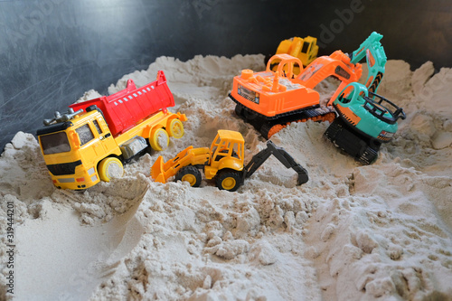 small kid toy vehicle construction in sand playground
