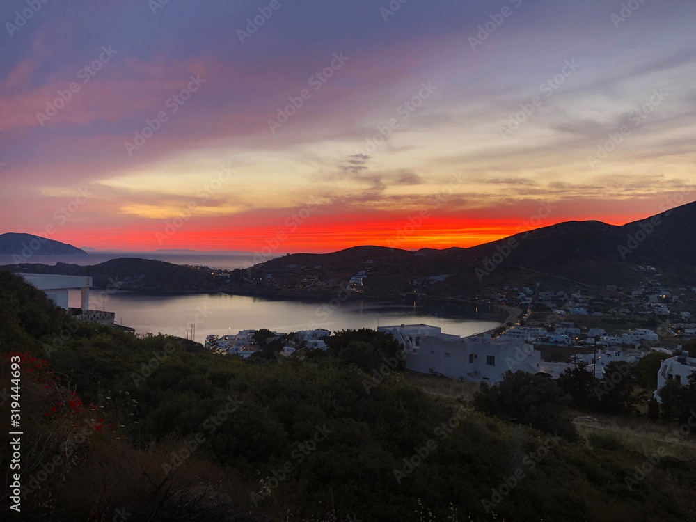 Sunset over Ios island bay and port