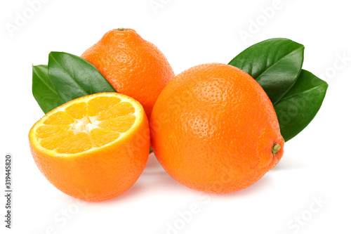 Orange clementine or minneola tangelo with slices and green leaves isolated on white background. Tangerine. Citrus fruit.