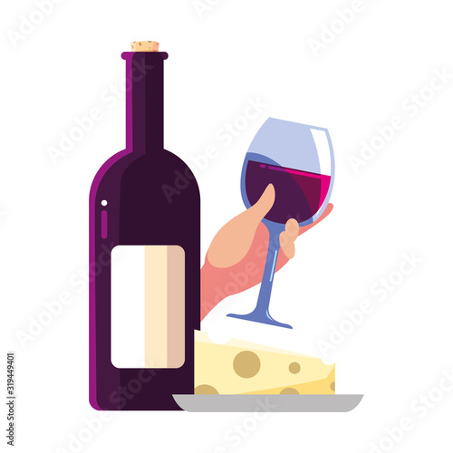 bottle and glass of wine with piece of cheese