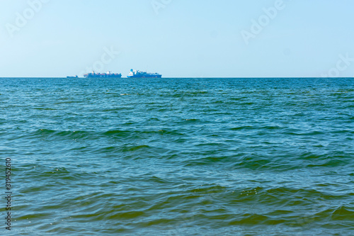 The calm sea. The quiet on the sea. Sea without waves. Seascape The ships in the Harbor.
