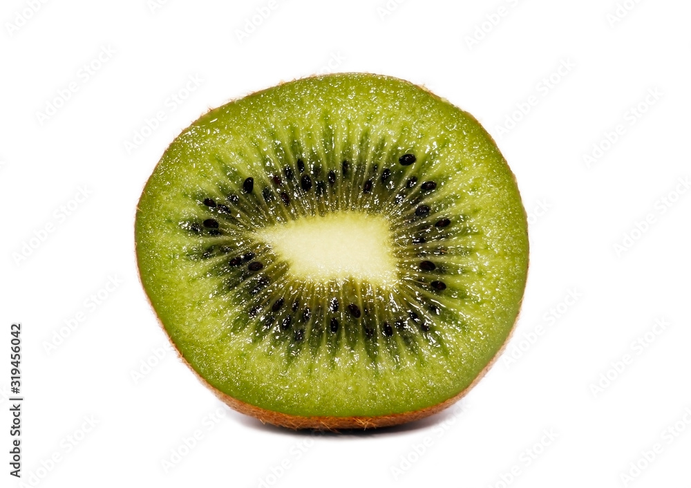 Natural juicy kiwi. Sweet and sour half of an exotic fruit of green color. Natural juicy kiwi. Sweet and sour half of an exotic fruit of green color.