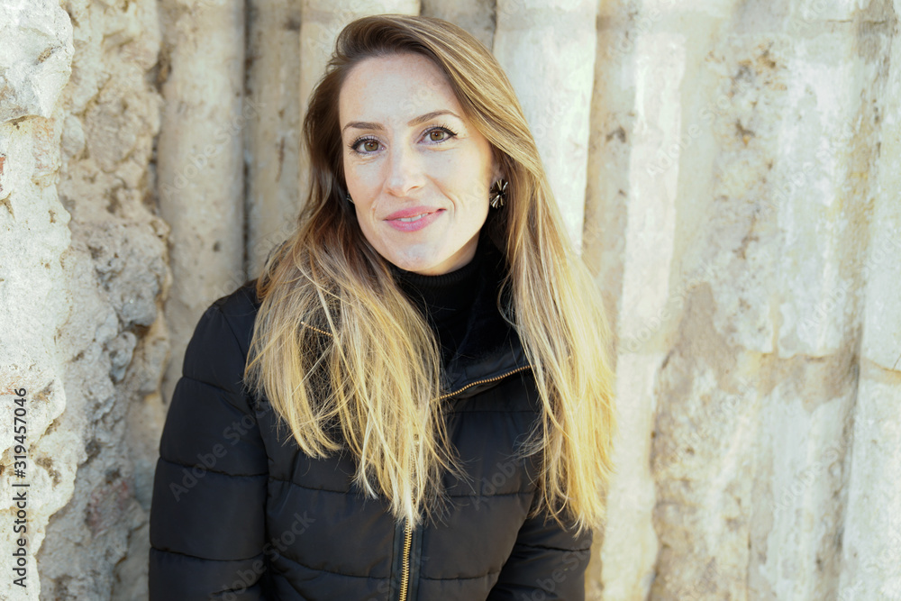 Young pretty cheerful woman posing winter city outdoor beautiful long blonde hair background urban lifestyle Young pretty cheerful woman posing winter city outdoor beautiful long blonde hair background urban lifestyle