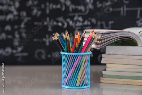 School books on desk, education concept.