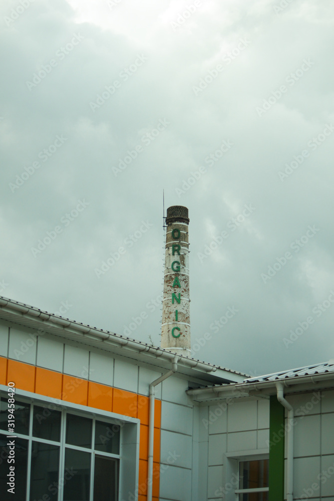 Fototapeta premium Rusty pipe. Factory produce organic milk