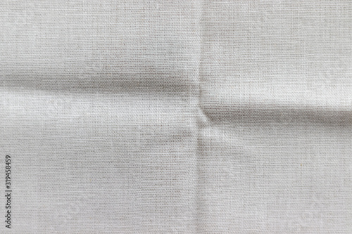 Natural linen fabric texture. Rough crumpled burlap background