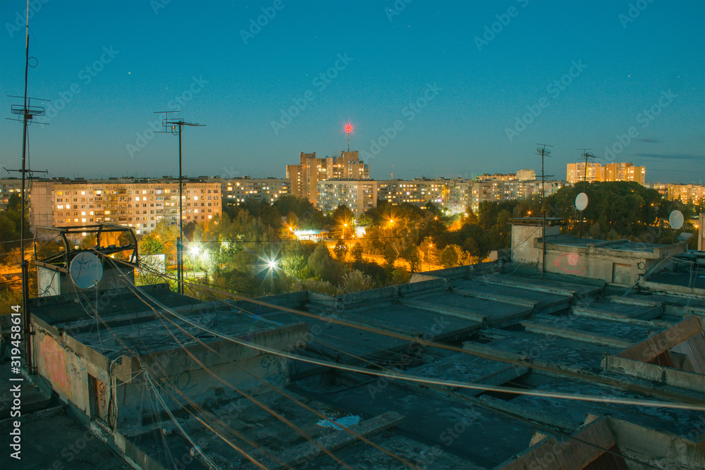rooftop building panels with wires at evening