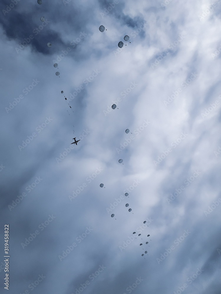 Army paratroopers jumping at air war action. Army paratroopers jumping at air war action.