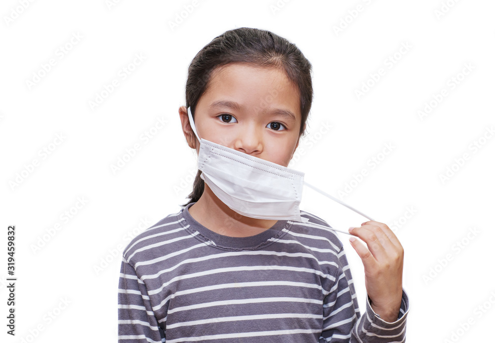 Asian kid taking off surgical mask Asian kid taking off surgical mask