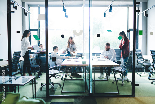 Wallpaper Mural Colleagues working at table in office Torontodigital.ca