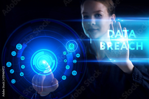 Business, Technology, Internet and network concept. Young businessman working on a virtual screen of the future and sees the inscription: Data breach