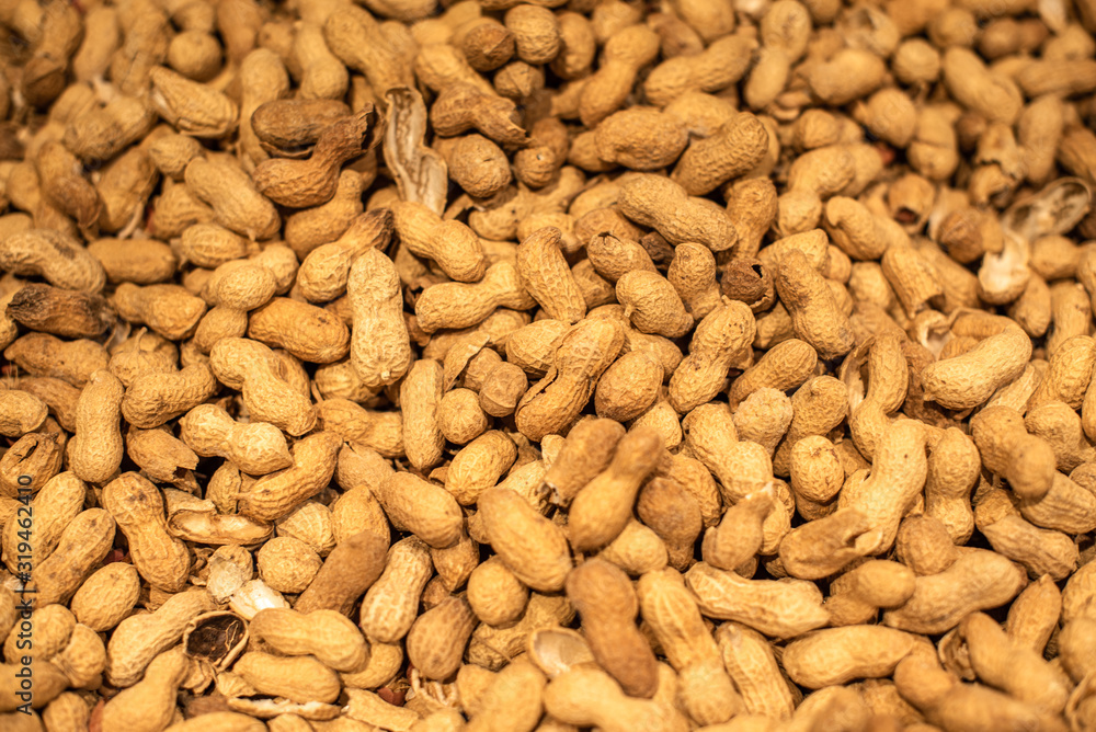 Peanuts in their shell texture food background fresh delicious vivid golden Peanuts in their shell texture food background fresh delicious vivid golden