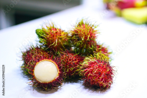 Fresh Rambutan on white table background. Close up Rambutan peeled