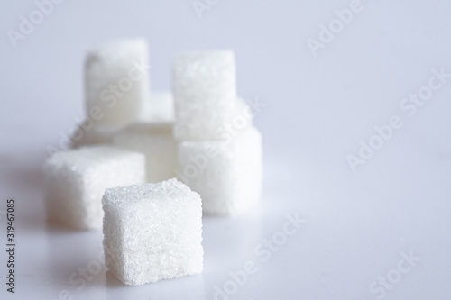 White sugar cube on white background.