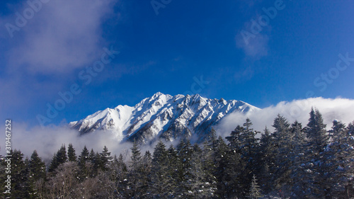 Japan Aleps mountains in winter cover with snow and blue sky during travel in Shinhotaka ropeway, Japan © Surasak Chuaymoo