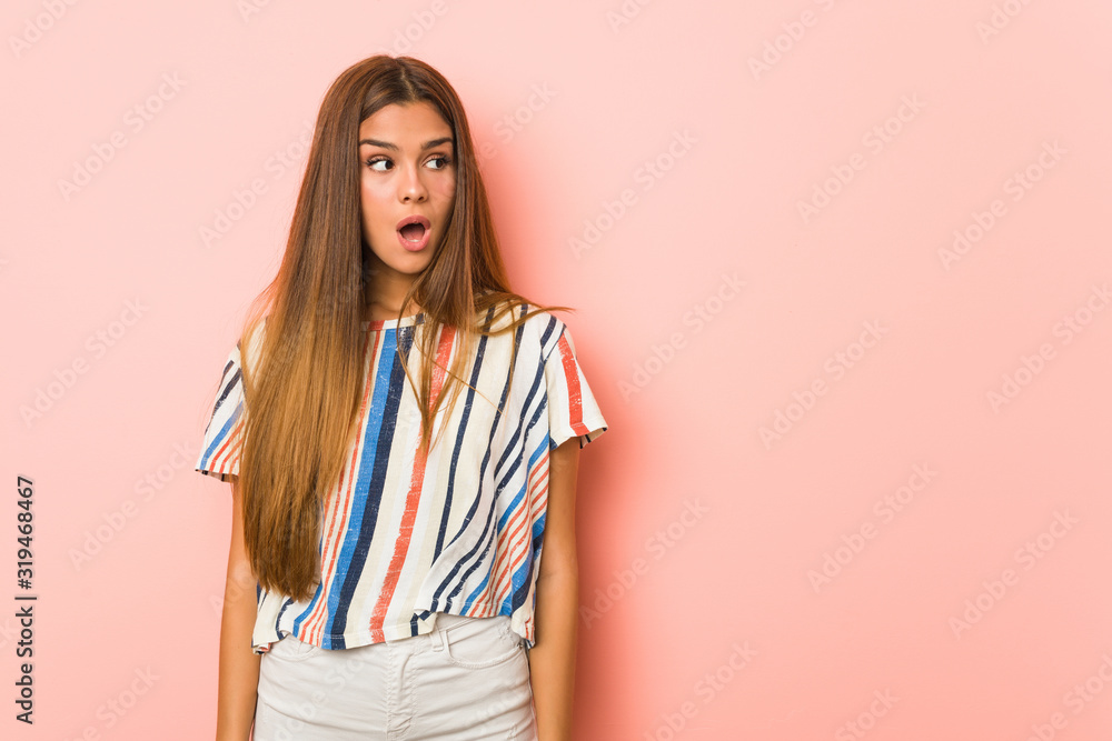 Young slim woman being shocked because of something she has seen. Young slim woman being shocked because of something she has seen.
