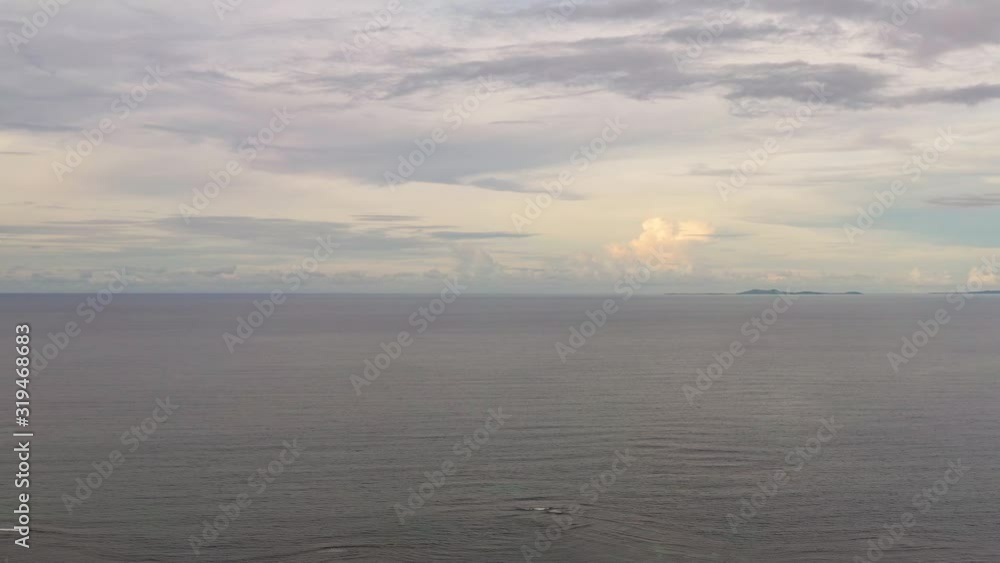 Seascape in the evening. Calm sea and island. Summer and travel vacation concept. Seascape in the evening. Calm sea and island. Summer and travel vacation concept.