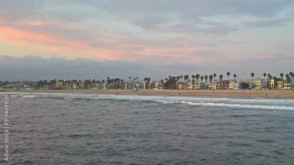 Blue ocean waves and Venice beach at sunset in Los Angeles Blue ocean waves and Venice beach at sunset in Los Angeles