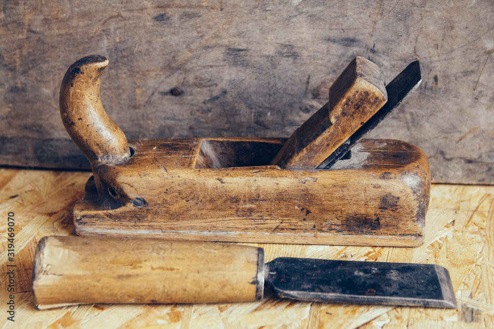 Old construction tools on a wooden workbench flat lay background. Carpenter table. Woodwork Old construction tools on a wooden workbench flat lay background. Carpenter table. Woodwork