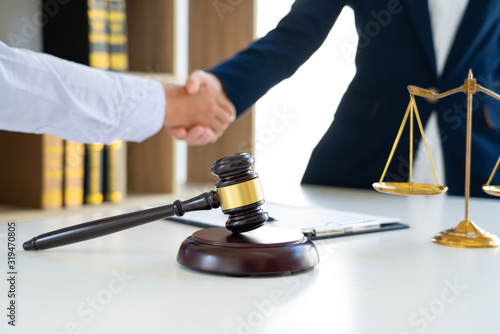 Photography Judge And Client Shaking Hands after agreeing to enter into a contract for a cou