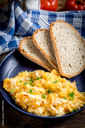 Scrambled eggs with onion and chives.