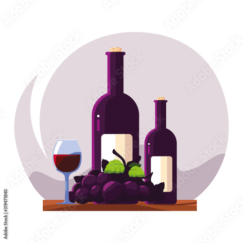 bottle and glass of wine with grapes