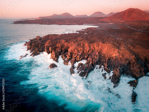 Aerial view of Los Hervideros lava cliffs and ocean. Lanzarote, Canary Islands. photo